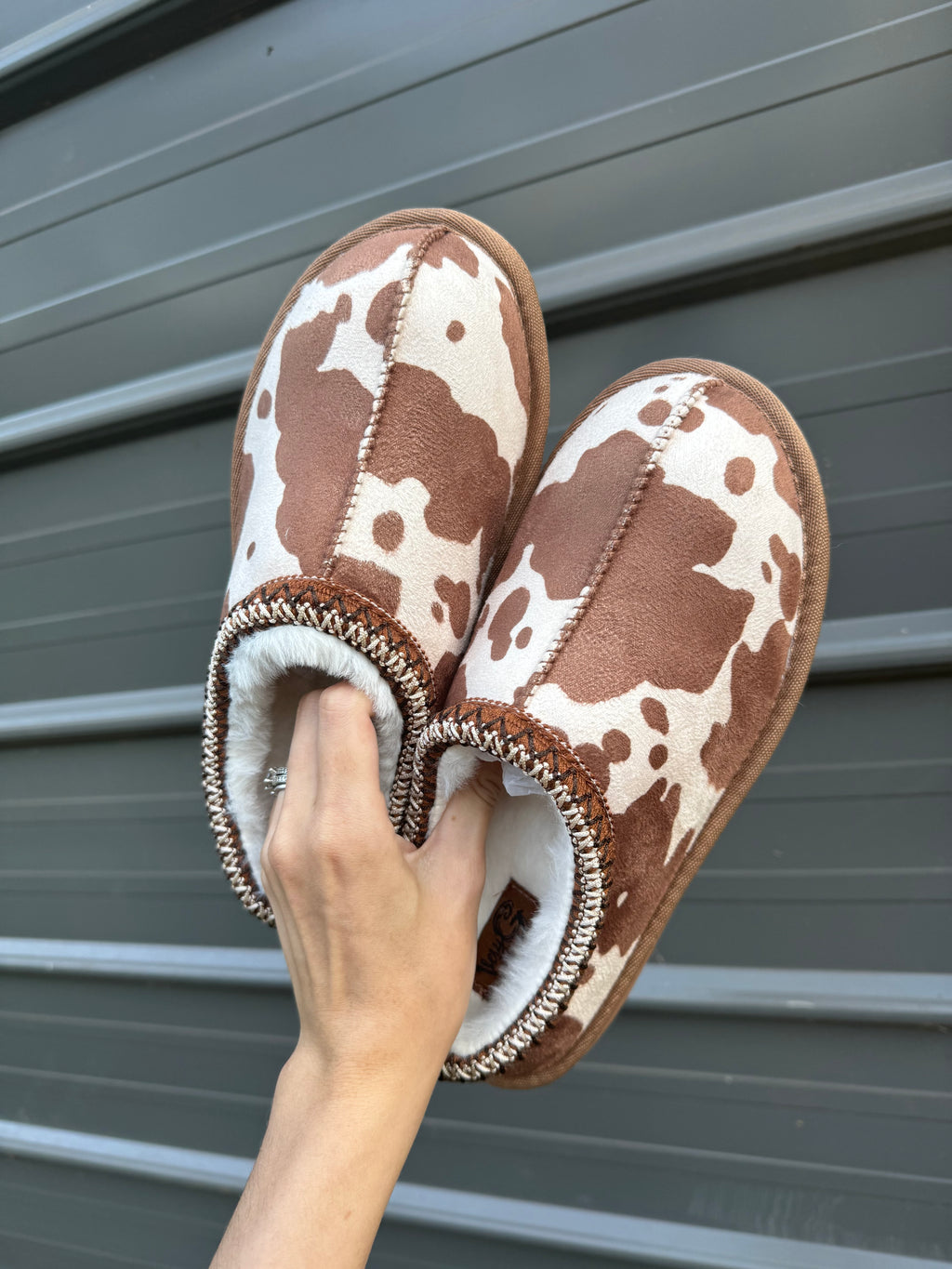 Cow print bruin slippers